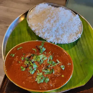 a bowl of curry and a plate of rice