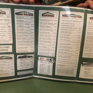 a person holding a menu