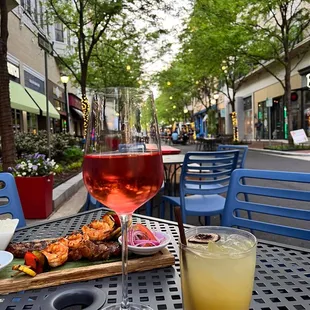 a glass of wine and a plate of food