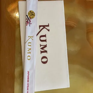 a menu and a knife