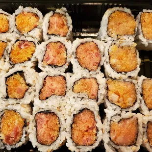 a close up of a tray of sushi