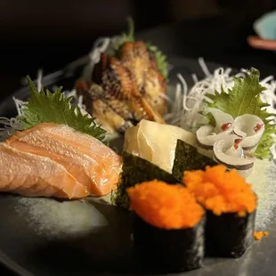 Salmon, unagi, and needlefish Sashimi. Smeltfish roe