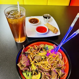Beef lo mein with an eggroll