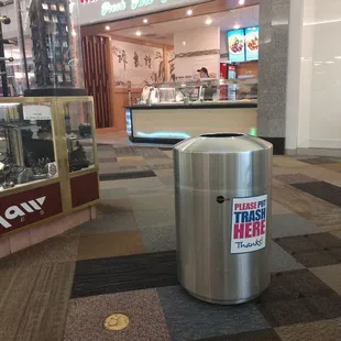 a trash can in a mall