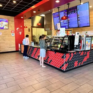 two people standing at the counter