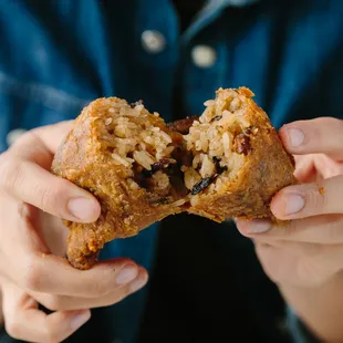 a person holding a muffin