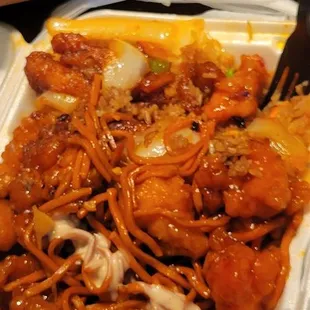 Half/half noodles and fried rice with orange chicken and Cajun chicken. *after picture*