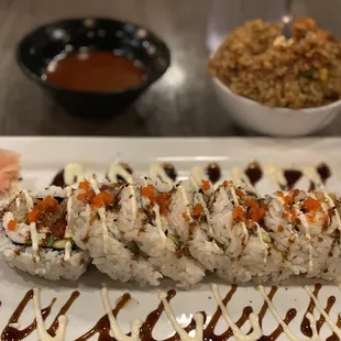 Booty Booty roll, fried rice, and hot and spicy sauce.
