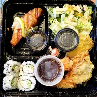 a bento box with a variety of food items