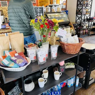 a coffee shop counter with various items on it