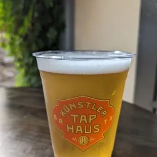 a glass of beer on a table