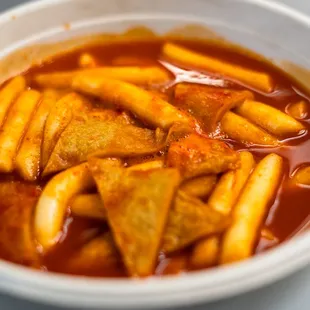 a bowl of food with sauce