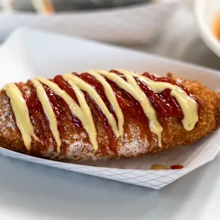 a hot dog with ketchup and mustard