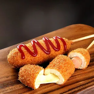 a close up of a hot dog roll with ketchup