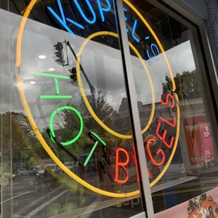 a neon sign in the window