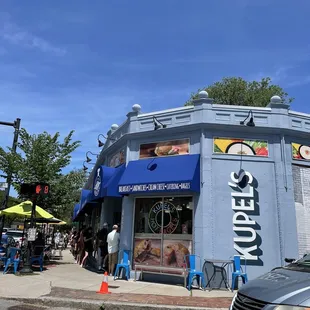 a blue building with a blue awning