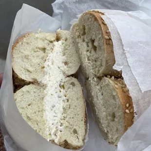 Sesame bagel with olive cream cheese