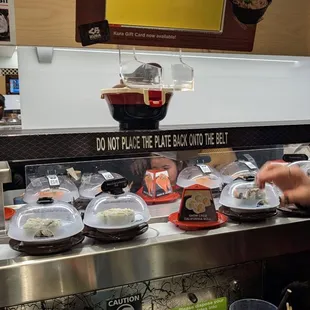 Conveyor and menu screen