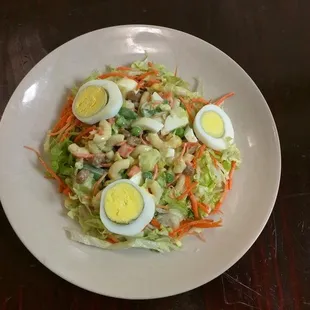 a plate of salad with hard boiled eggs