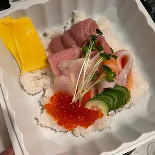 a person holding a container of food