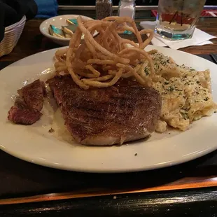 12oz ribeye, Parmesan potatoes and onion rings