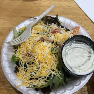 a salad with ranch dressing