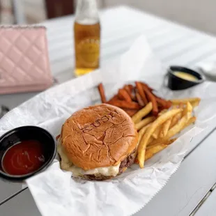 Frita burger (beef patty, guava jelly, melted Gruyère cheese, crisp bacon)