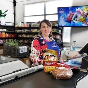 a woman behind the counter