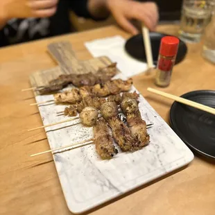 Quail egg wrapped in bacon Enoki wrapped in pork belly  Ribeye Chicken skin