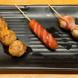 Tsukune Meatball (left), Kurobuta Pork Sausage (middle), Quail Egg Wrapped in Bacon (right)