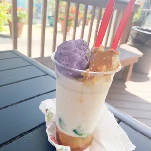 a cup of ice cream and a scoop of ice cream
