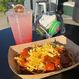 a hot dog and a drink on a table