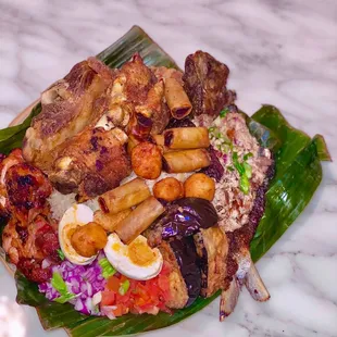 bilao family meal- crispy pata, bangus sisig, chicken tocino with fried eggplant, lumpia, &amp; karioka (11/2022)
