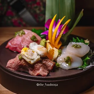 Chutoro (Medium Fatty Tuna), A5 Miyazaki Wagyu topped with quail egg, and Scallop Sashimi