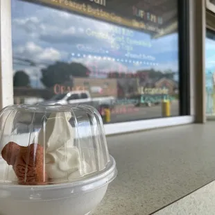 Vanilla ice creams and a milk bone make a yummy puppy treat for just $1.50.