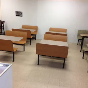 a room with several tables and chairs