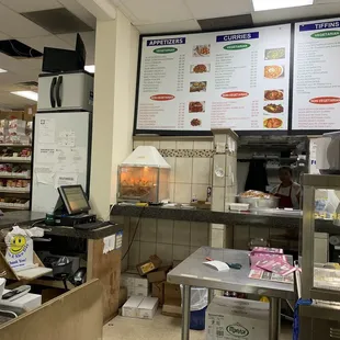 a large menu board in a restaurant