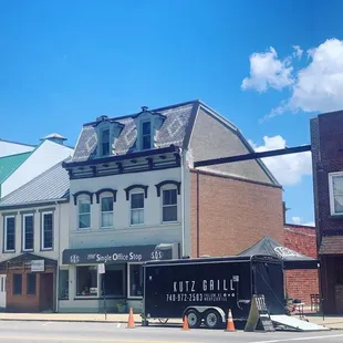 a truck parked in front of a building