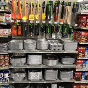 a variety of cooking utensils and pans