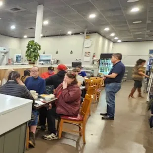 a group of people sitting at a table