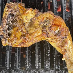 a piece of chicken on a grill
