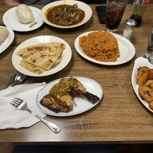 Chapati (flatbread) Jollof Rice Corn Fufu Ugali Fried Plantains Chicken thigh and goat curry