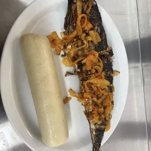 a fish and a banana on a plate