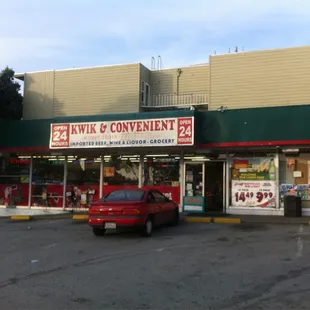 a car parked in front of a convenience store