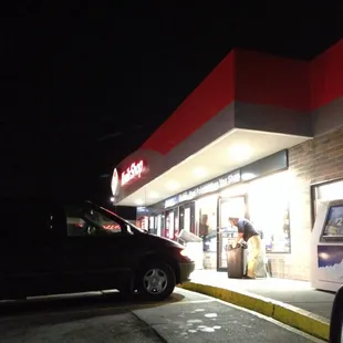 a car parked in front of the store