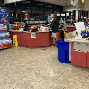 Employee with mask on chin.  Customer no mask.