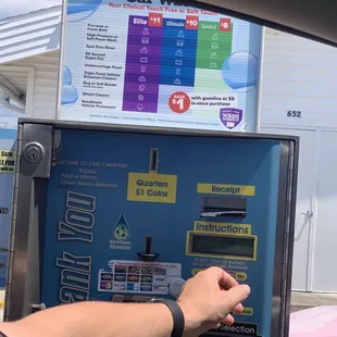 a person using a ticket machine