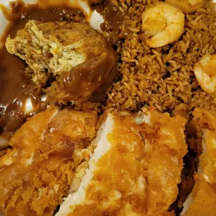 a plate of fried chicken, rice, and shrimp