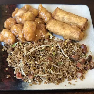 Pork fried rice, sweet and sour chicken, and egg rolls.