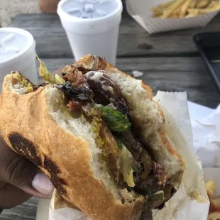 Grilled onions and mushroom!! Fresh beef patties and the bacon slices are extra thick.